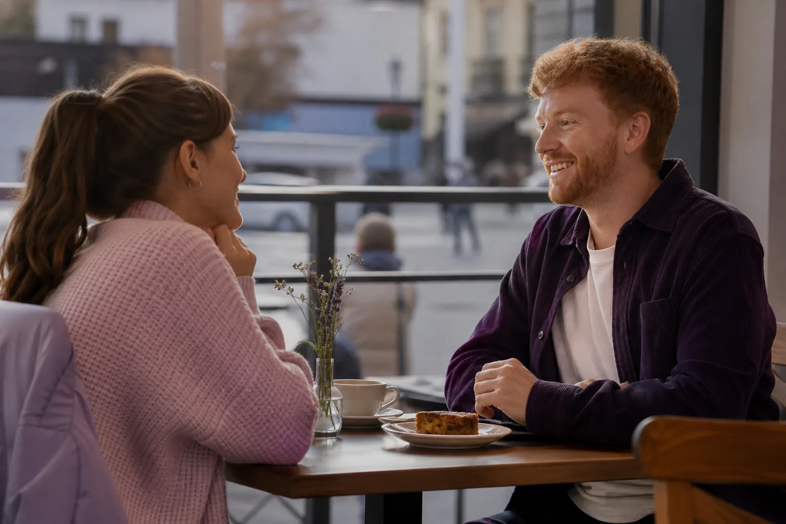A couple talking over coffee on a relaxed first date in Omagh